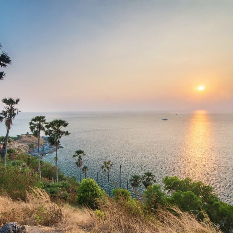 Sunset over the Andaman Sea from scenic coastal viewpoint in Phuket Thailand