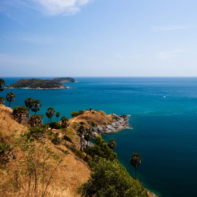 Dramatic coastal cliff and turquoise sea view in Phuket Thailand overlooking the Andaman Sea